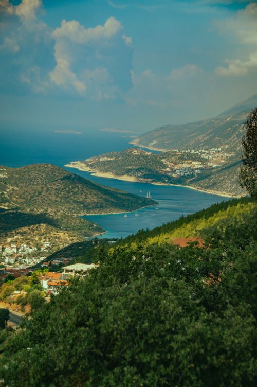 Free Stunning aerial view of a Mediterranean coastal landscape with lush greenery and ocean vistas. Stock Photo