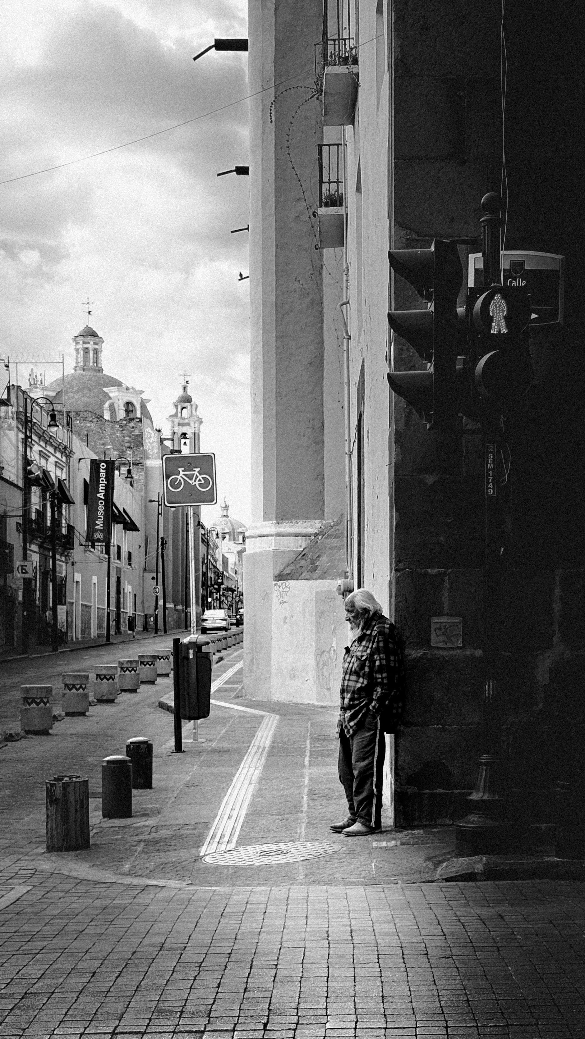 Captivating black and white street scene in Puebla, Mexico with historic architecture.