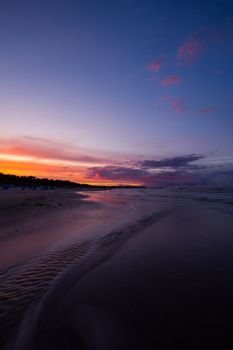Captivating sunset view over Heringsdorf beach with vibrant skies and tranquil ocean.
