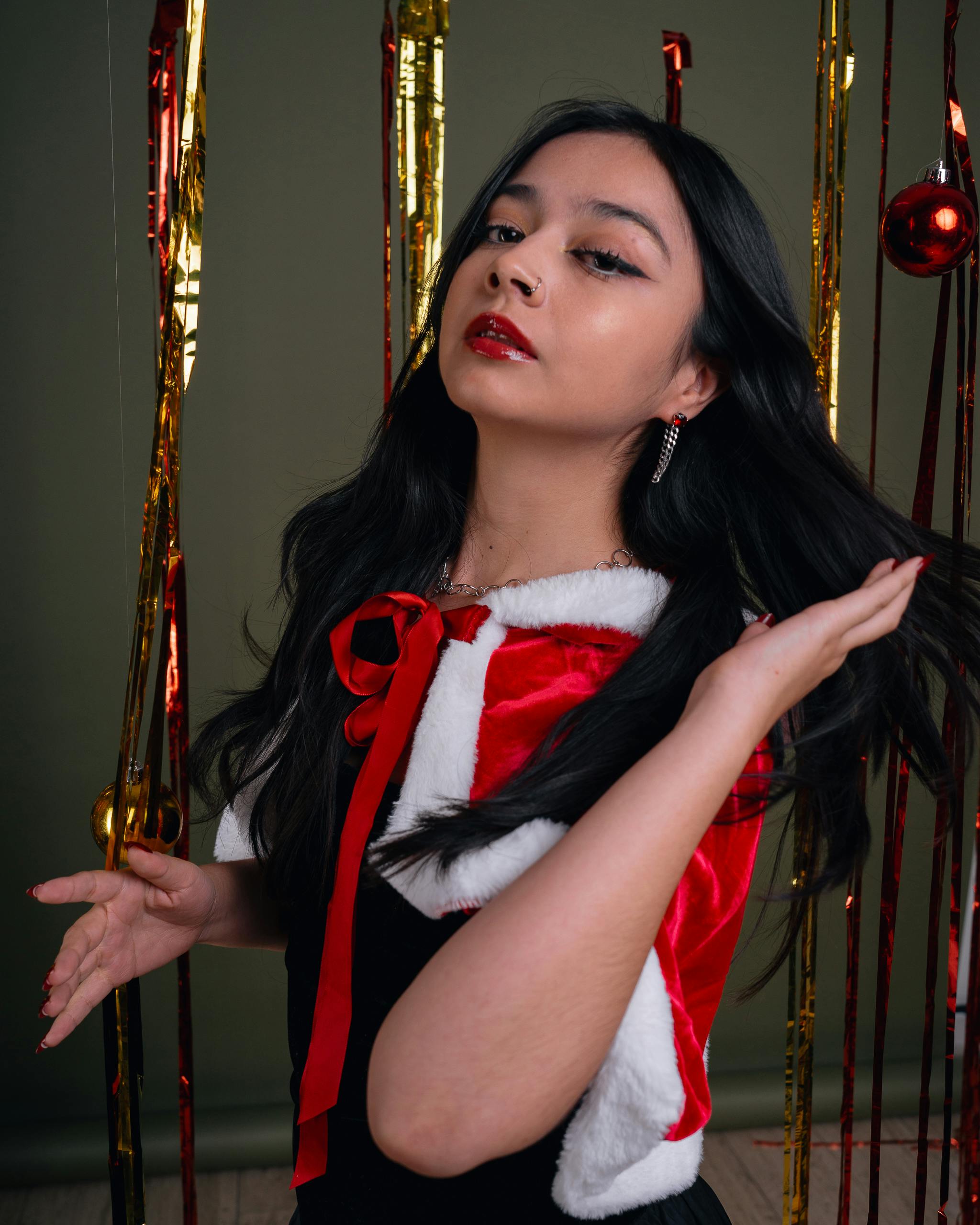 elegant woman in holiday attire with festive background