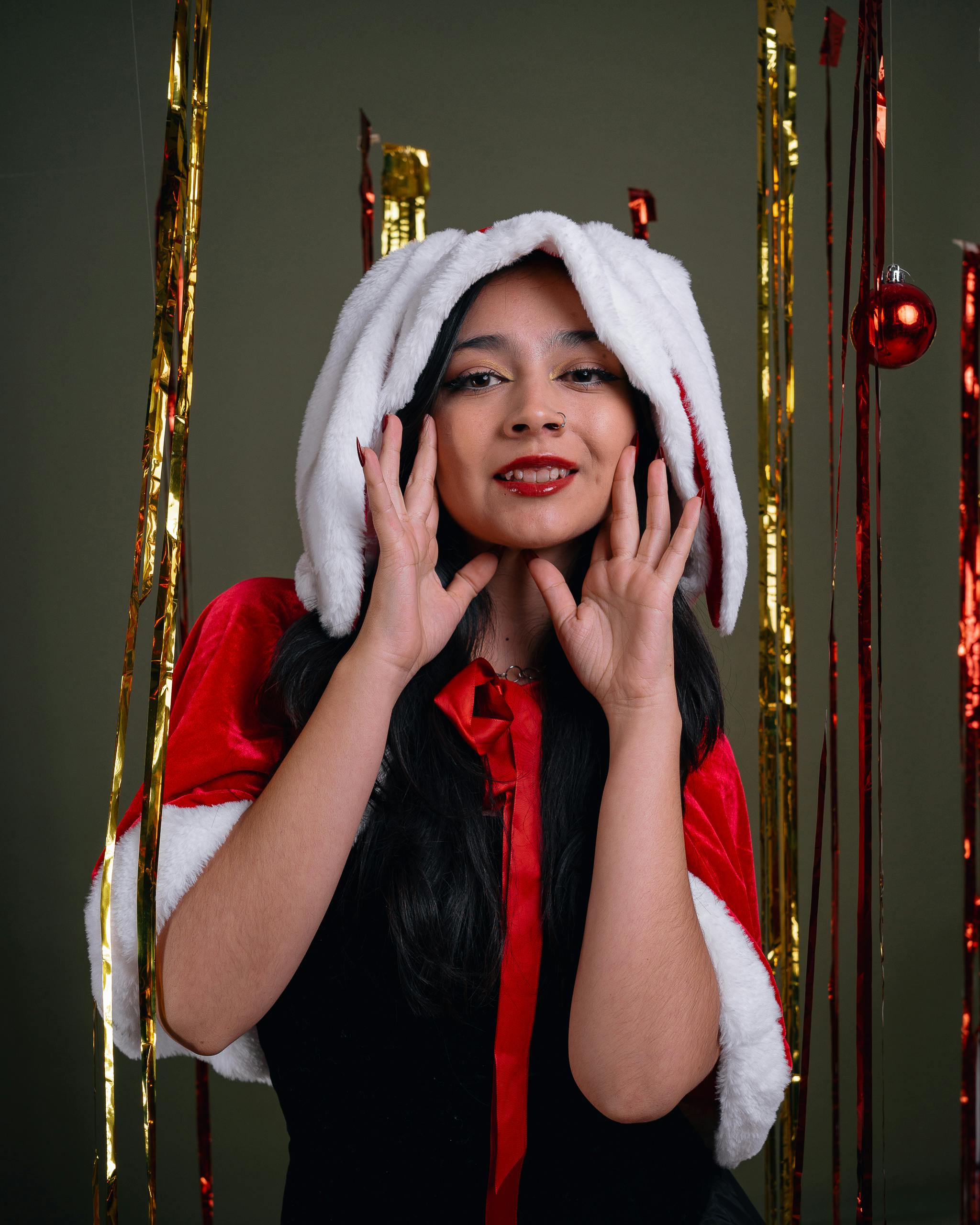 festive woman in santa hat celebrates christmas