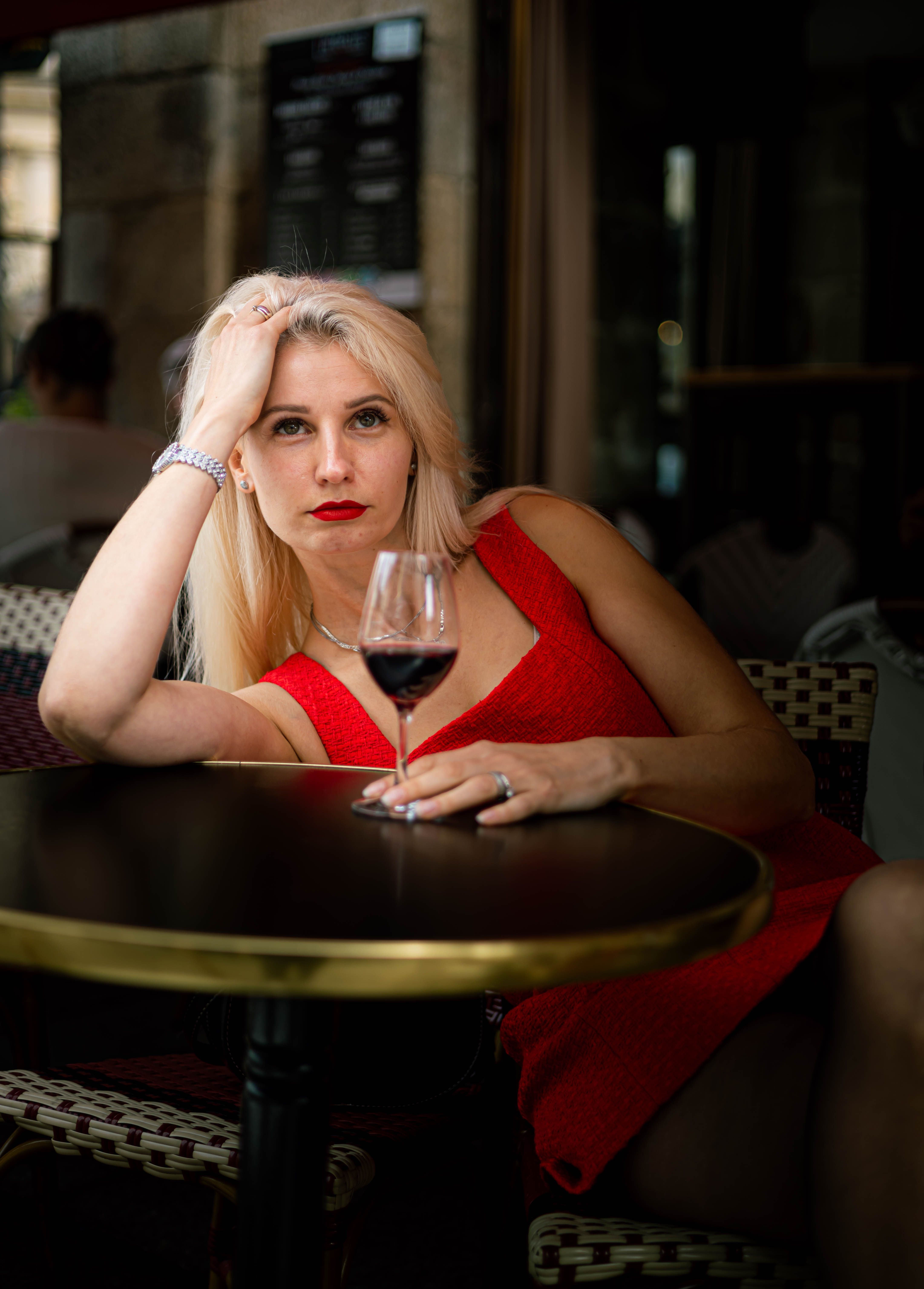 Elegant Woman Relaxing with Glass of Wine · Free Stock Photo