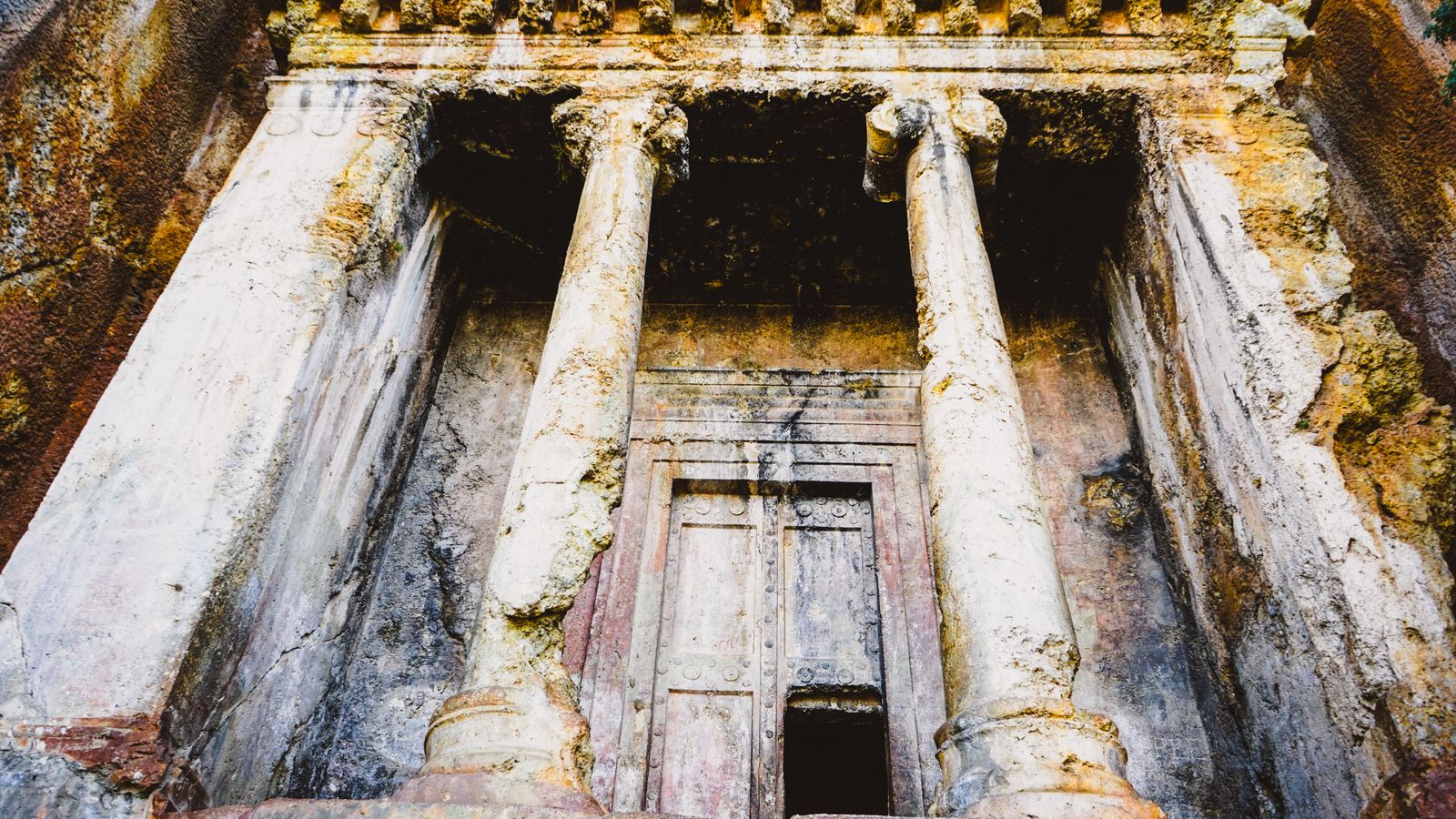 Ancient rock cut tomb in mugla turkiye, Uganda