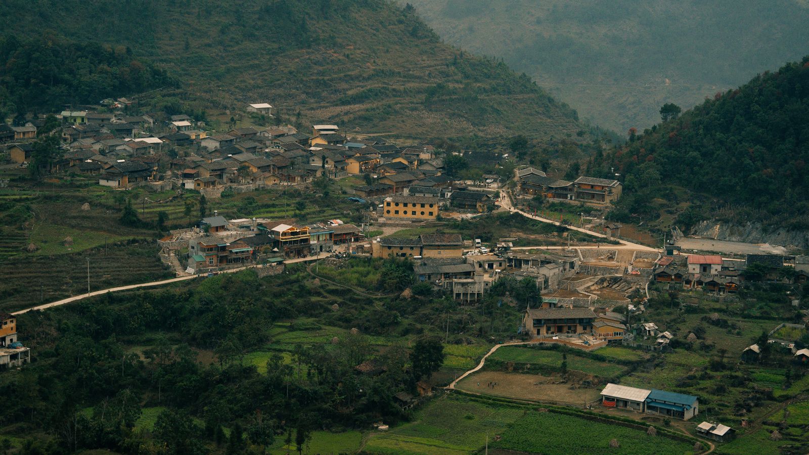 Aerial view of a Ha Giang mountain village showing why careful planning creates a better local travel experience