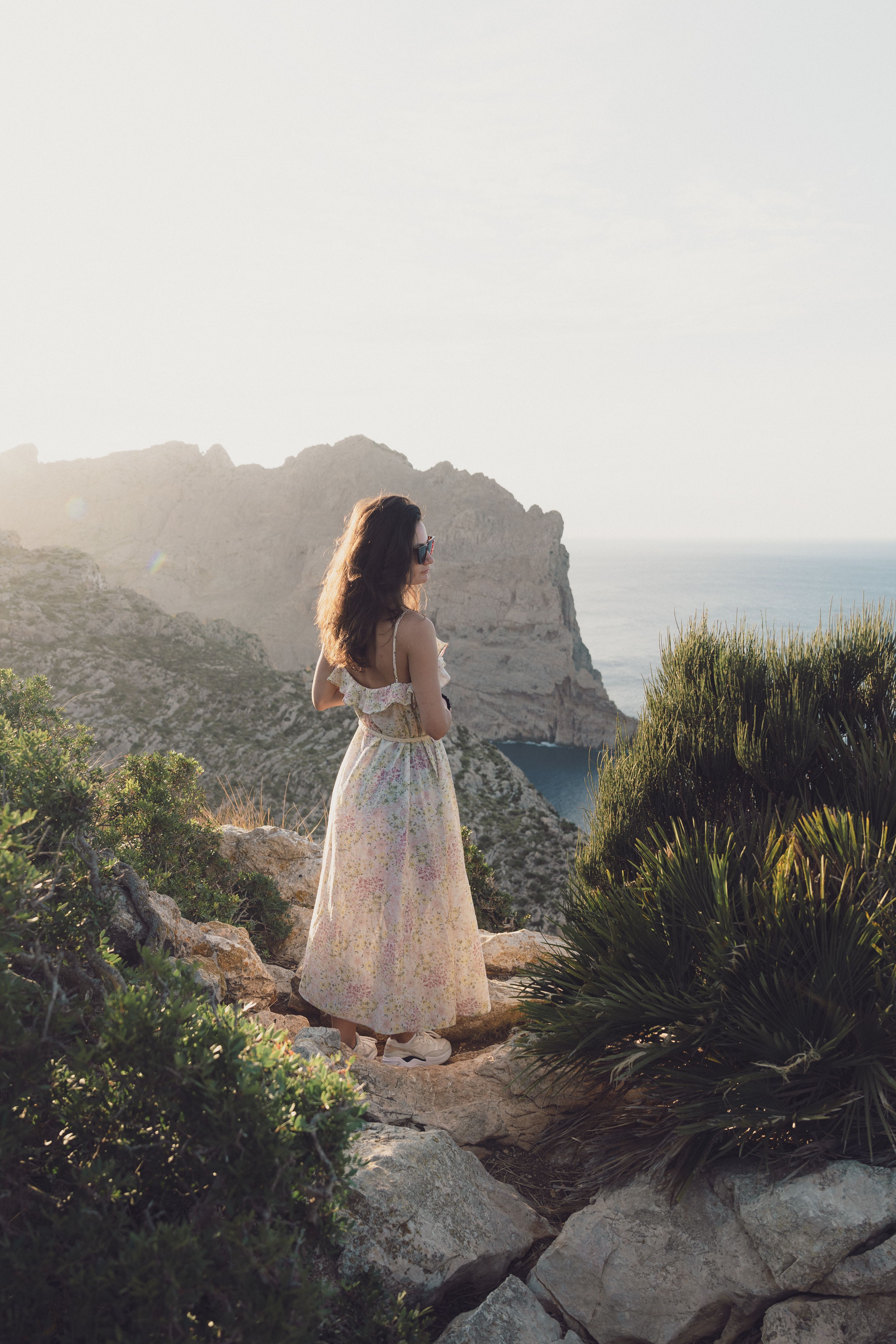 Woman Overlooking Scenic Coastal Landscape · Free Stock Photo