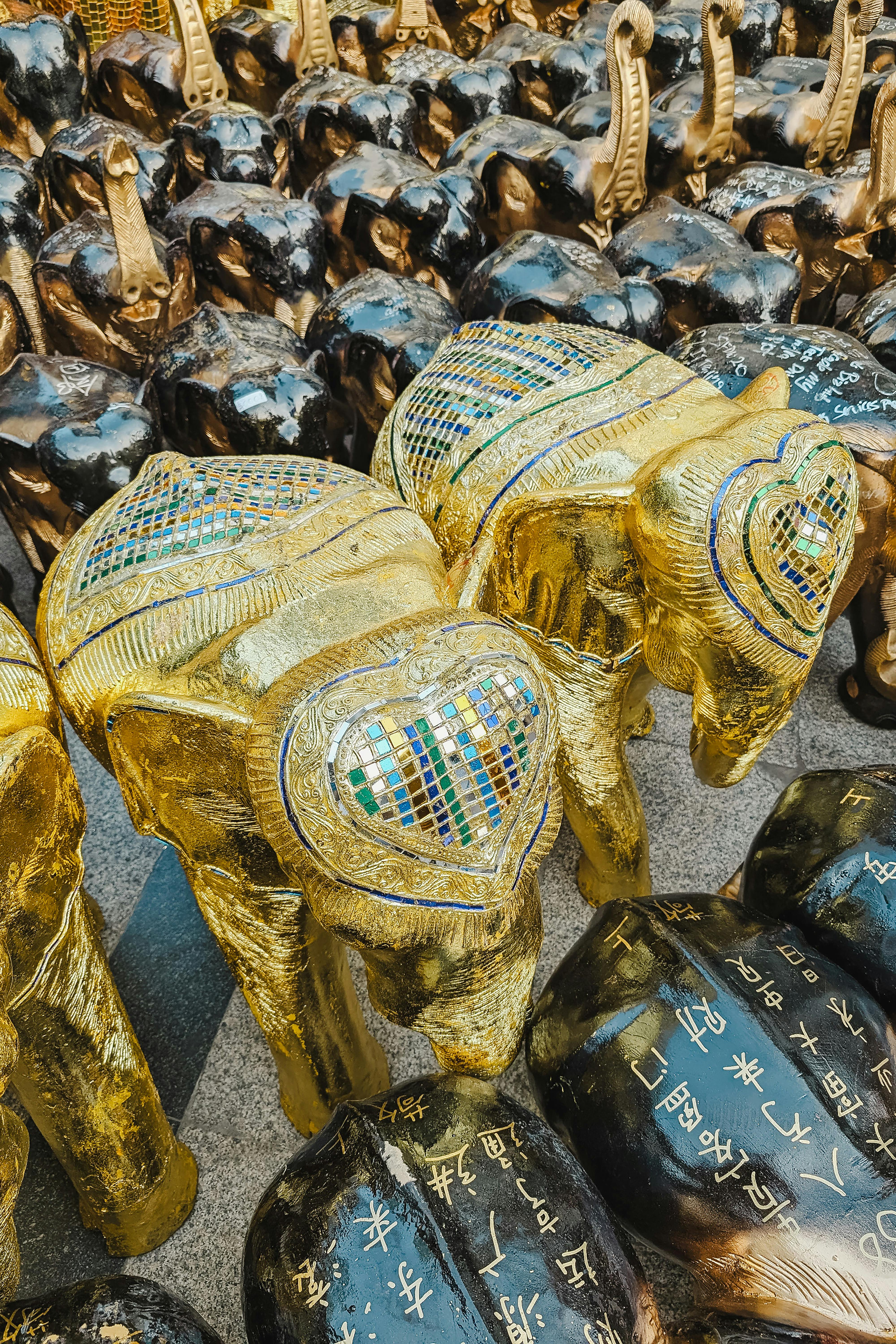 golden elephant statues with intricate patterns