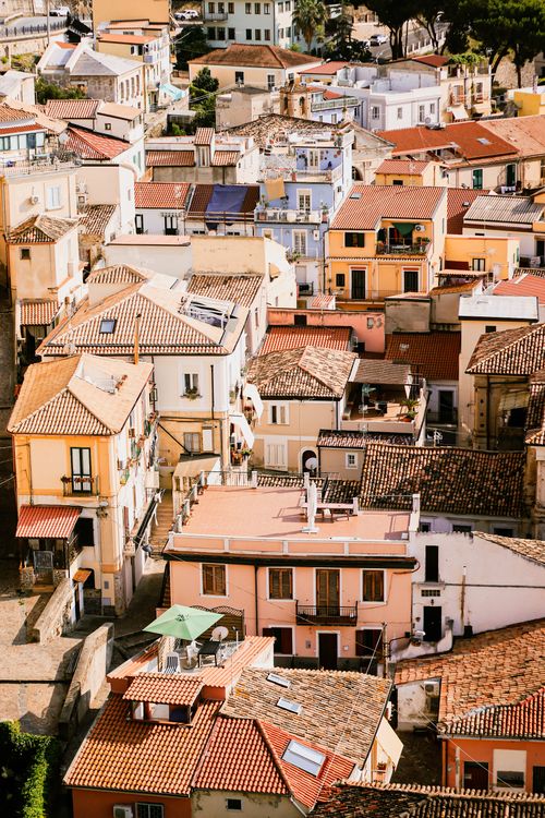 Free Aerial view of Italian rooftops with colorful facades under bright sunlight. Stock Photo