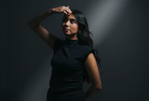 Free Artistic portrait of a woman in dramatic lighting, expressing introspection and mystery. Stock Photo