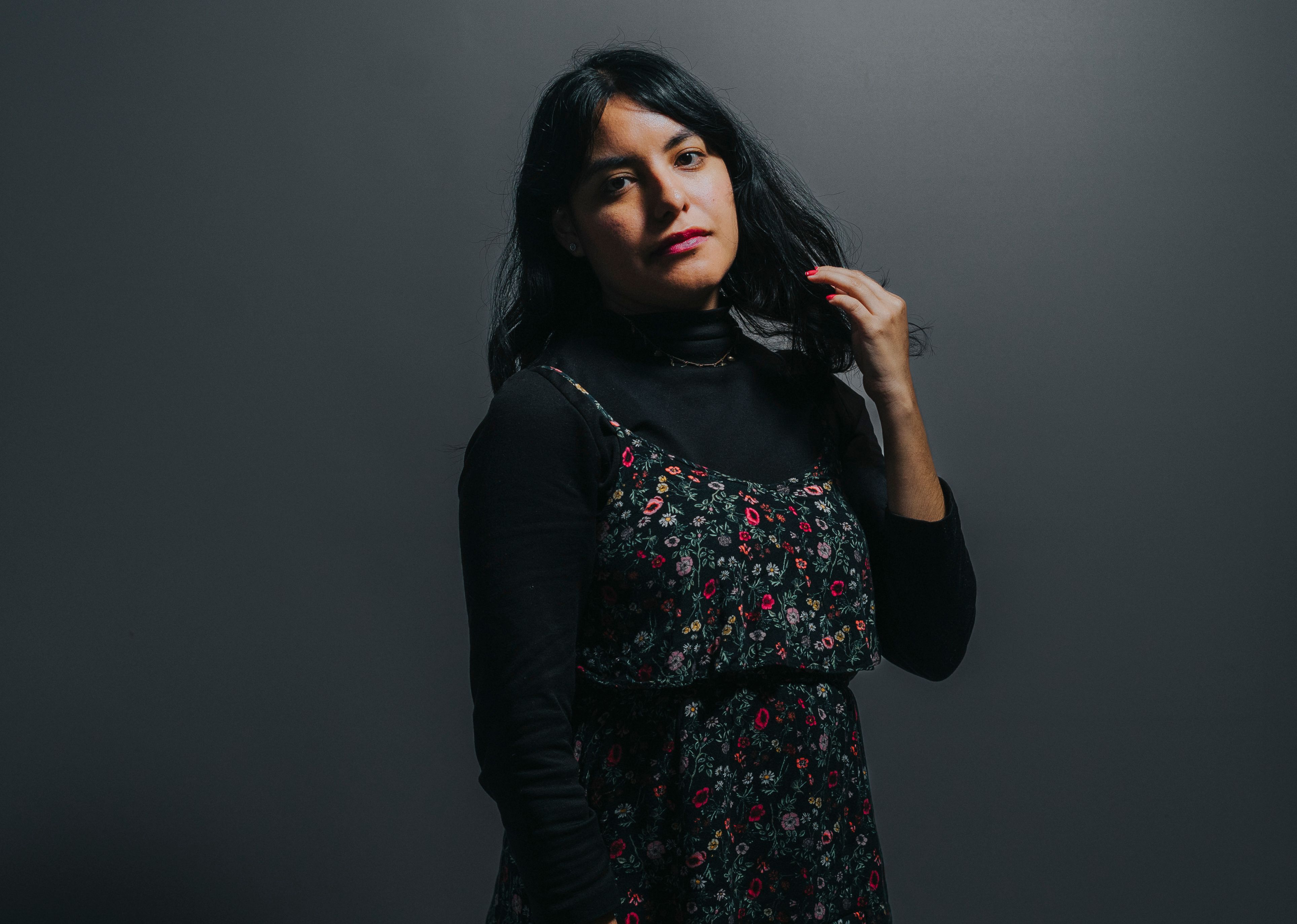 Elegant Woman in Floral Dress Portrait · Free Stock Photo