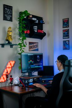 A creative workspace featuring video editing tools and colorful LED lights.