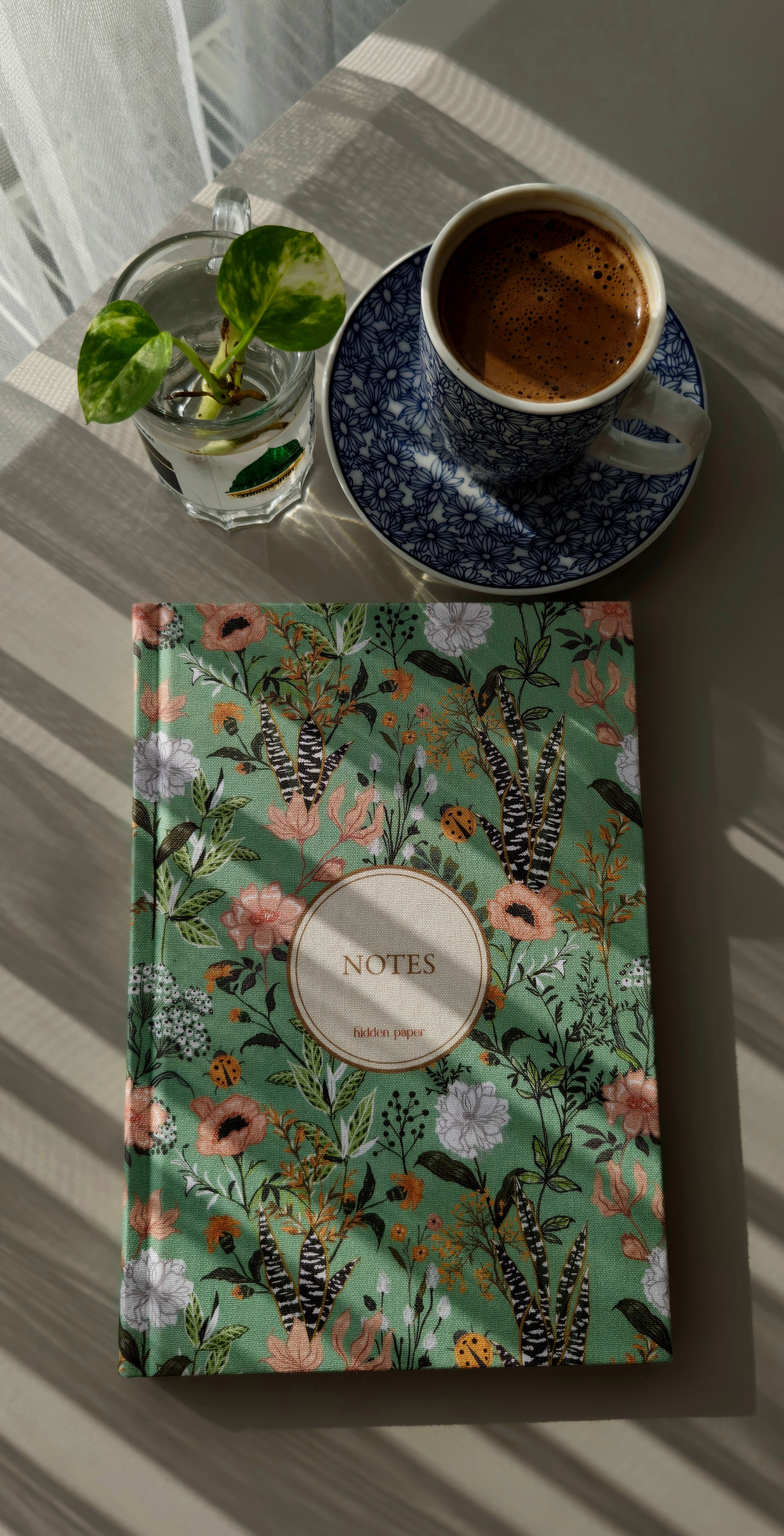 Stylish Setup with Floral Notebook and Coffee · Free Stock Photo