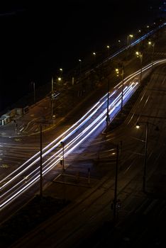 Long exposure shot of city street lights creating trails at night in Budapest.
