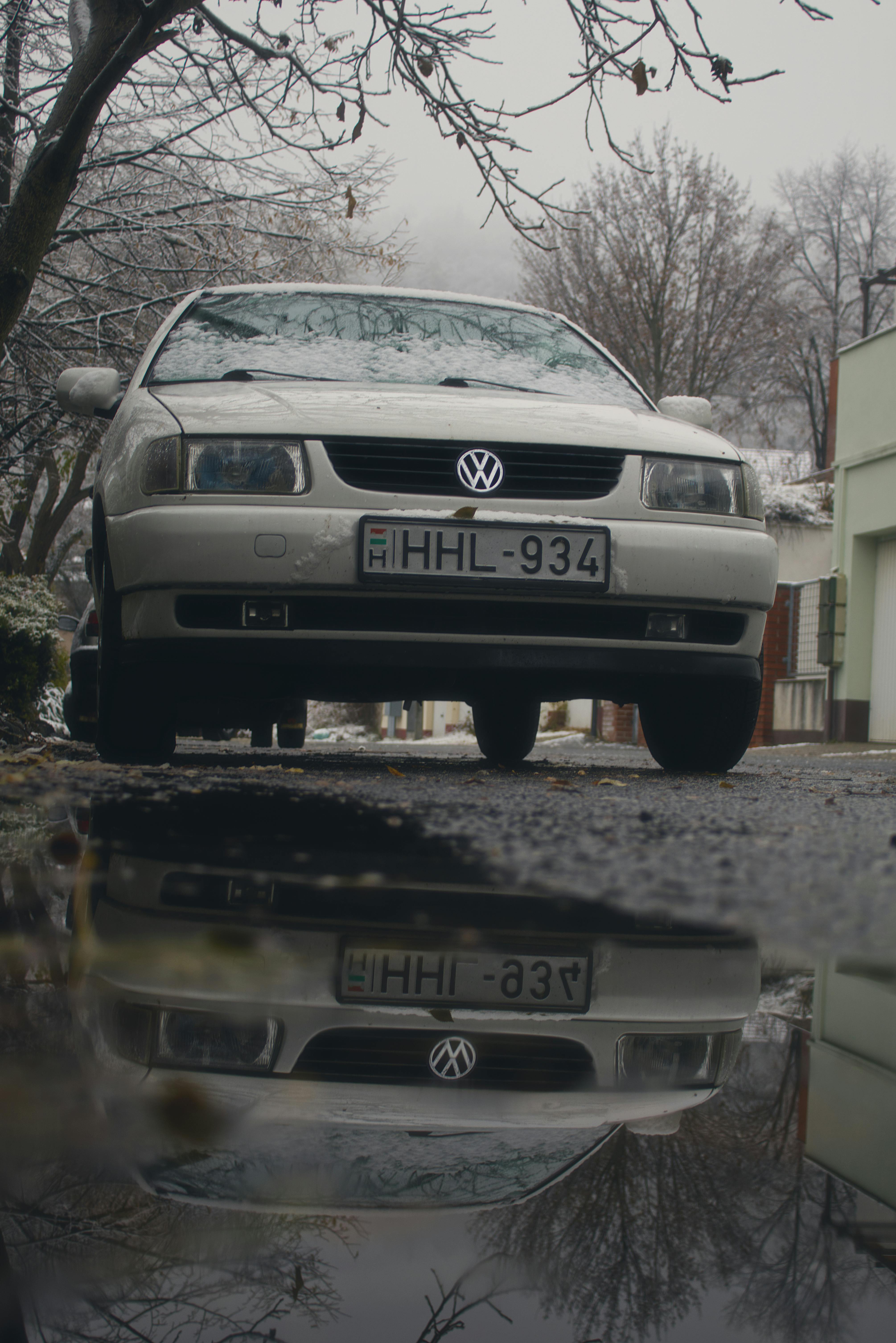 vintage volkswagen parked on wet winter street