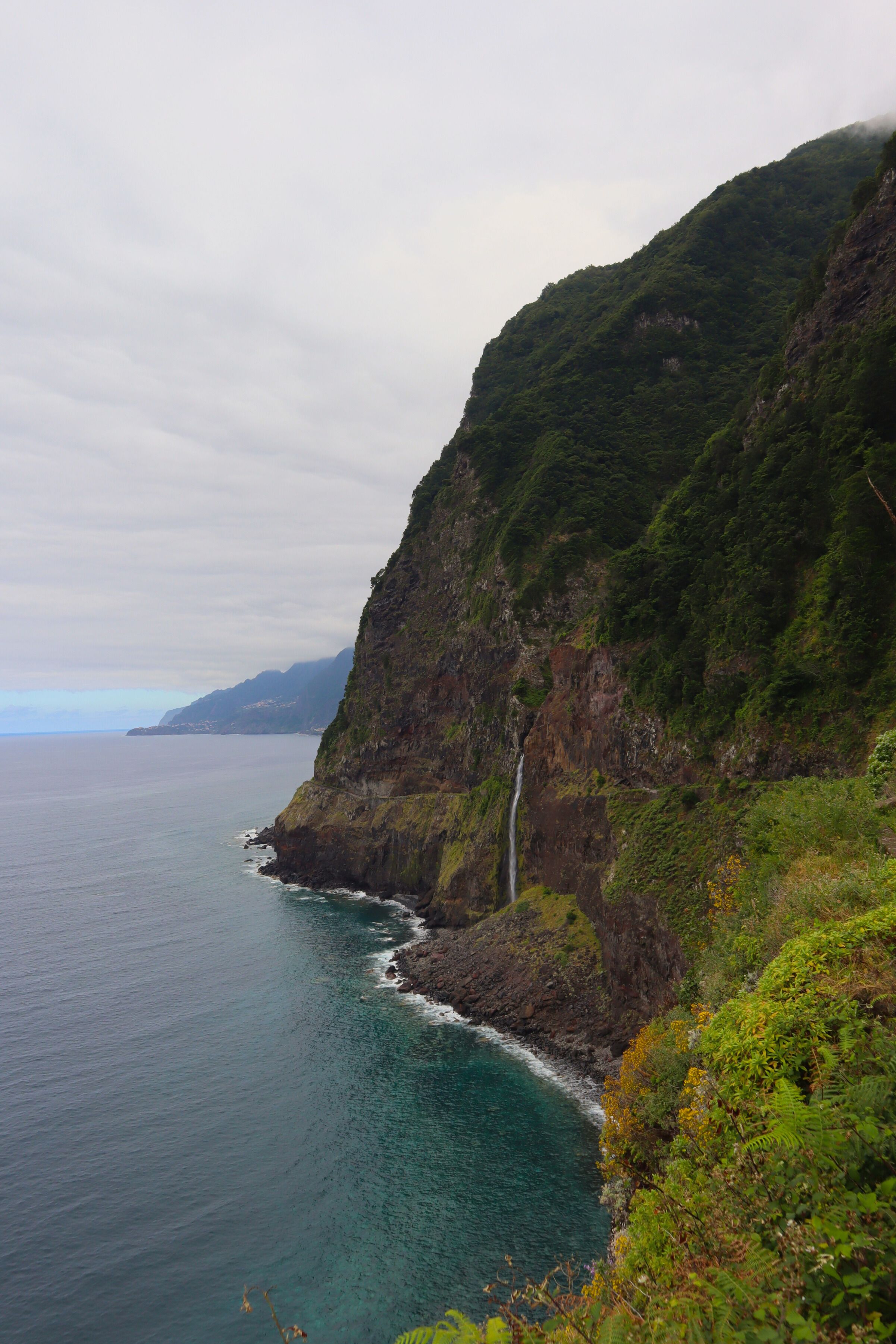 Green cliffs plunging into the Atlantic on Madeira