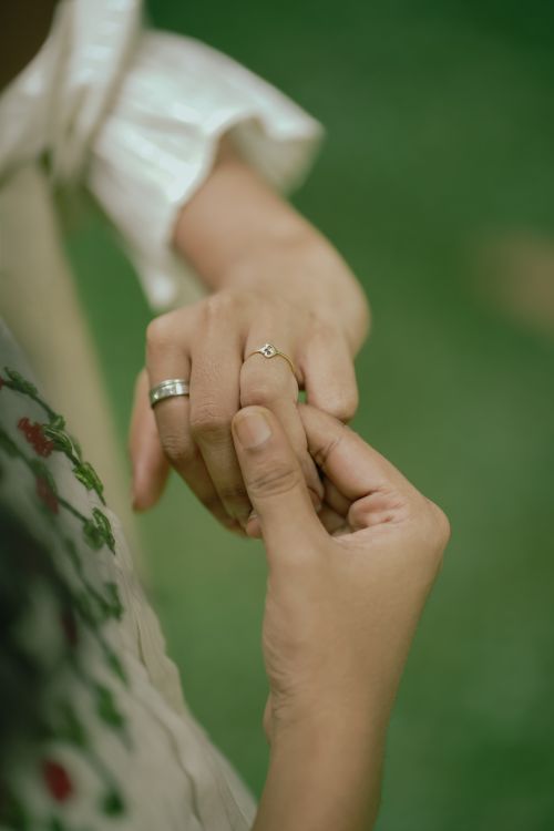 Free Intimate close-up of a wedding ring exchange ceremony with symbolic gesture and elegance. Stock Photo