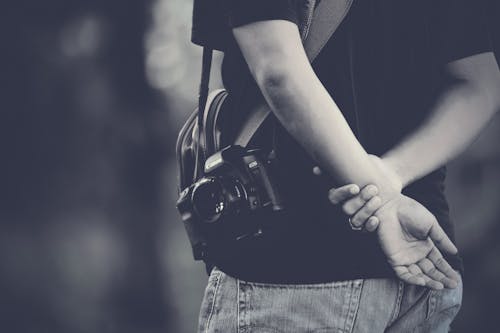 Grayscale Photography of Man Wearing Camera