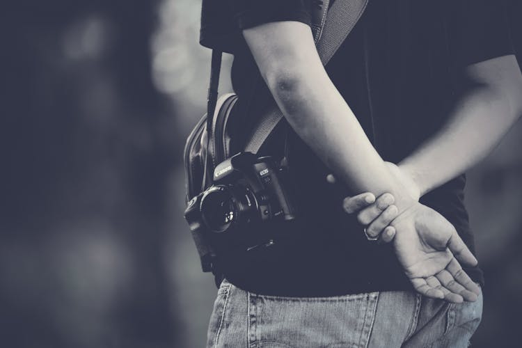 Grayscale Photography Of Man Wearing Camera