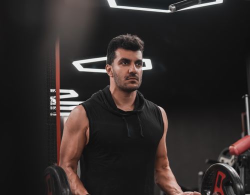Member performing hypertrophy training with weights