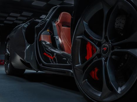 Detailed view of a McLaren car's luxurious interior and wheel, highlighting its elegant design in Ankara, Türkiye.