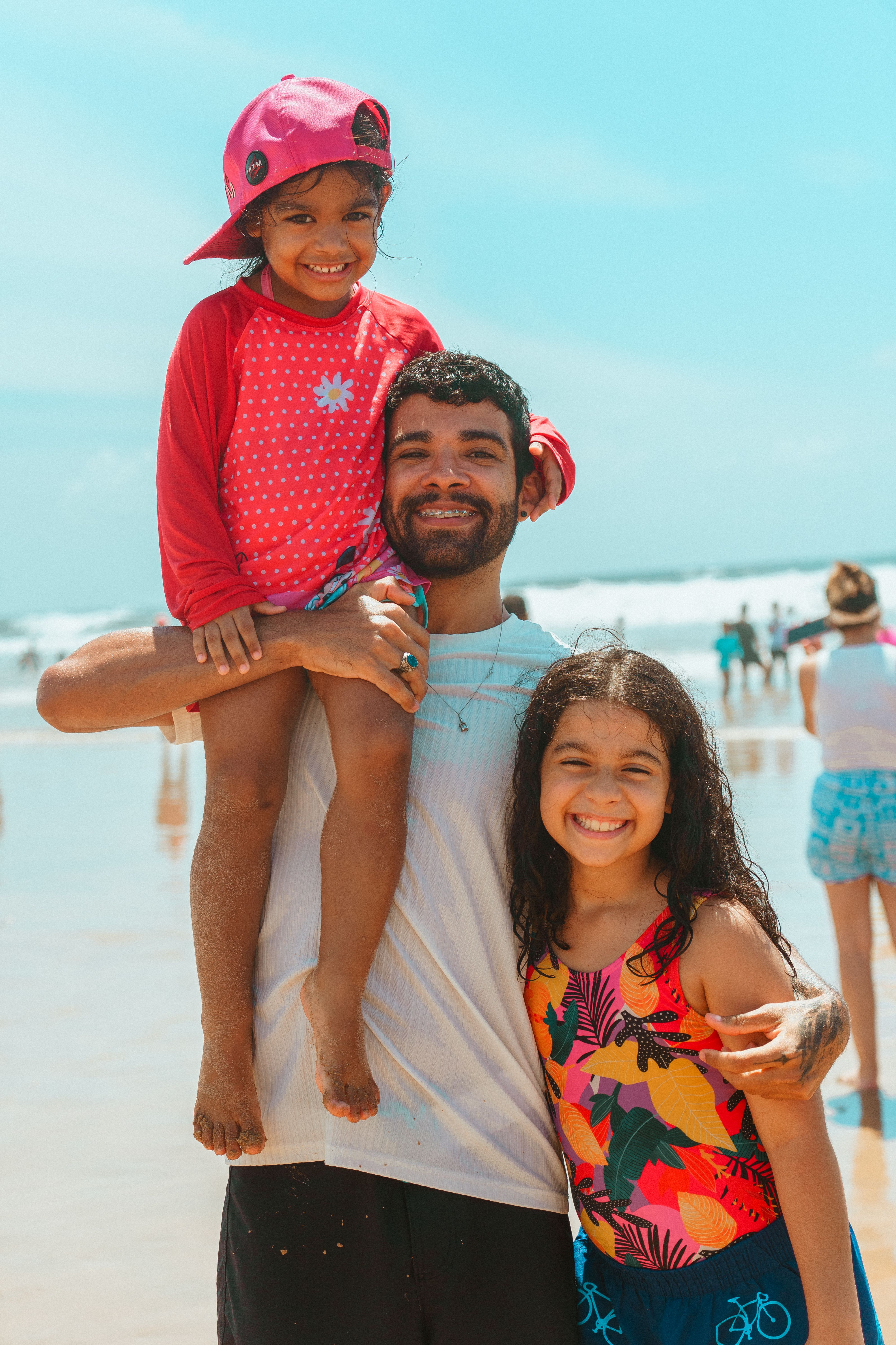 Family Enjoying a Sunny Day at the Beach · Free Stock Photo