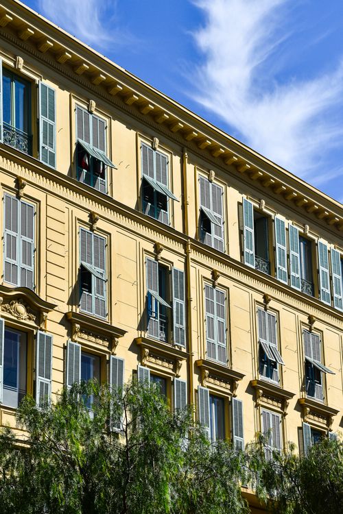Free Elegant building facade with shutters in sunny Provence, France. Stock Photo