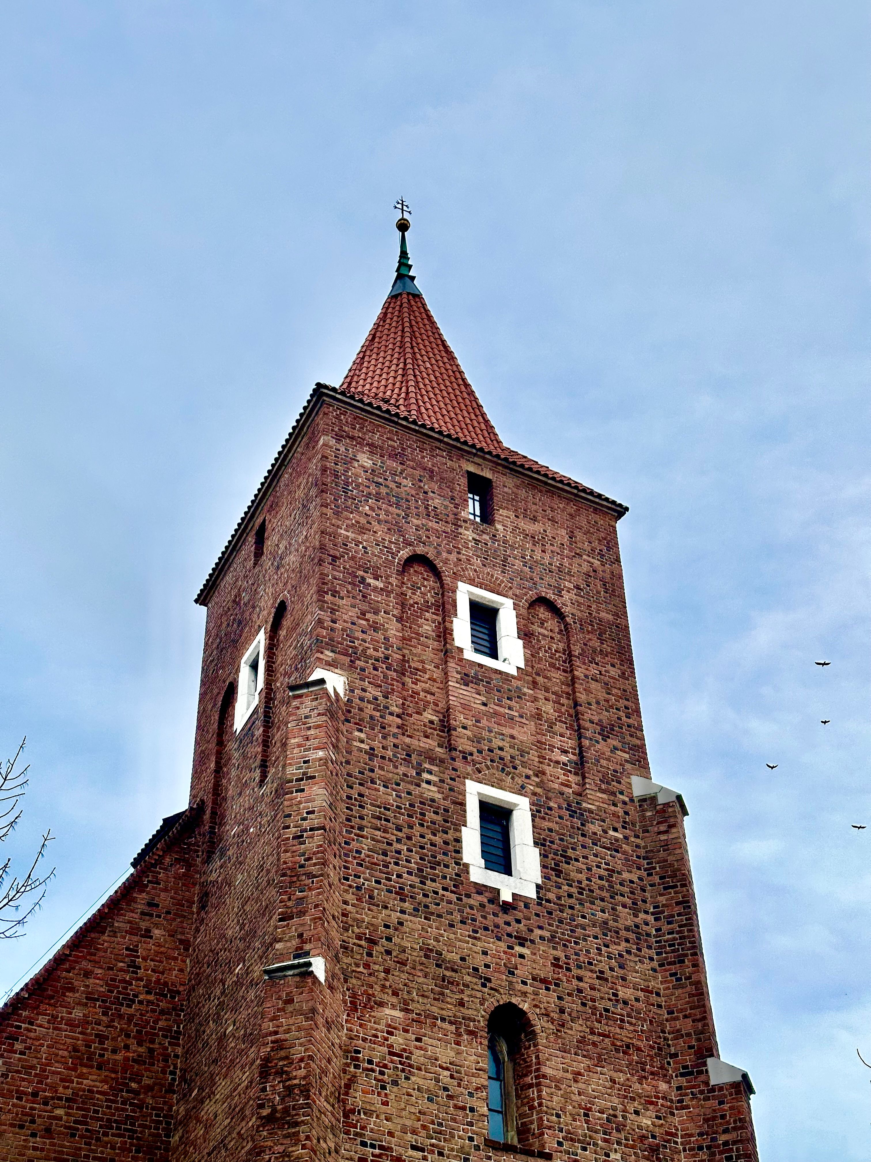 Historic Brick Church Tower Against Blue Sky · Free Stock Photo