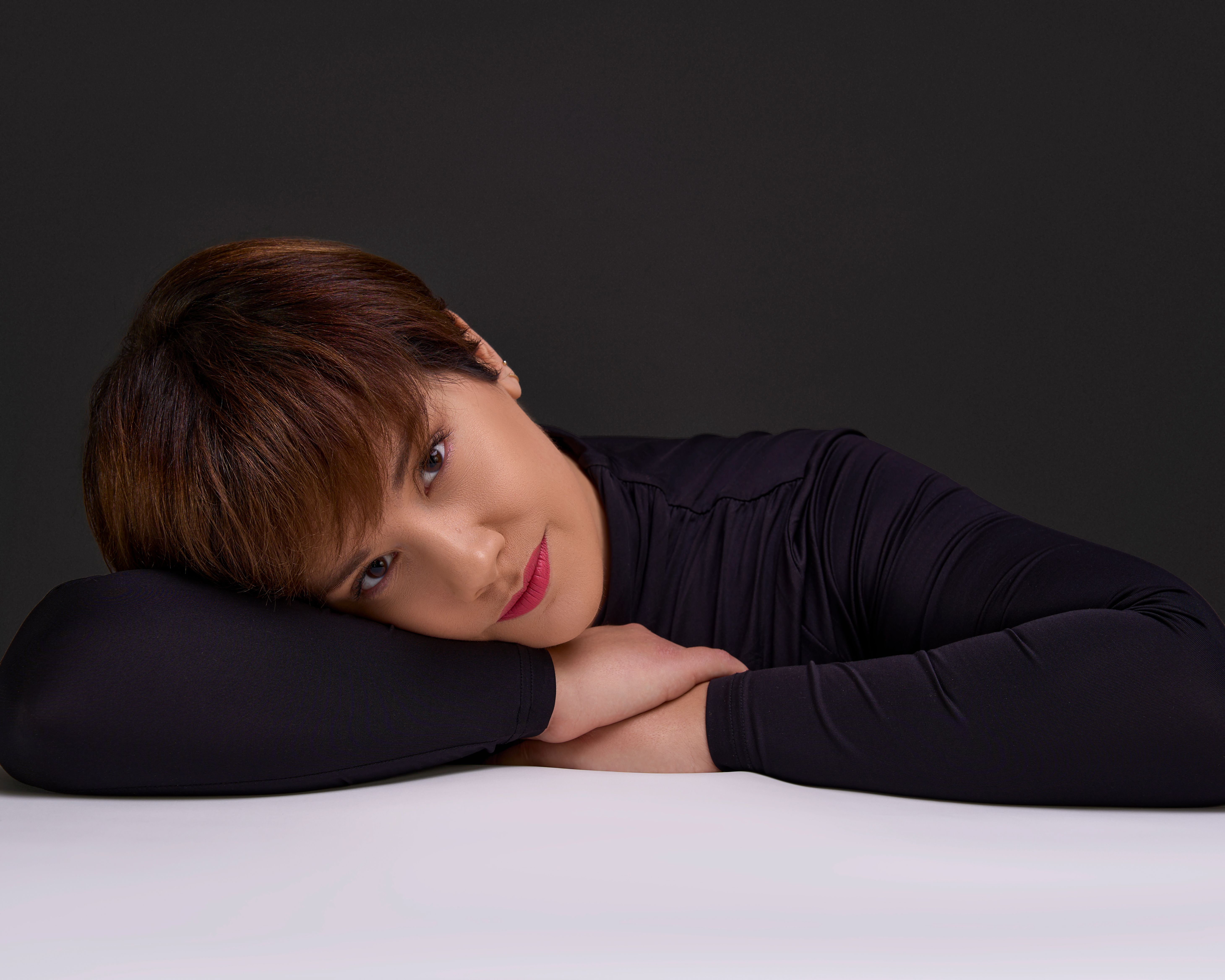 Artistic Portrait of Woman Resting on Table · Free Stock Photo