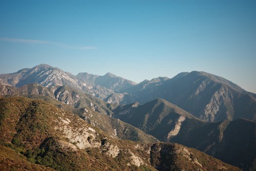 Breathtaking view of mountain range under clear blue sky in Los Angeles, California.