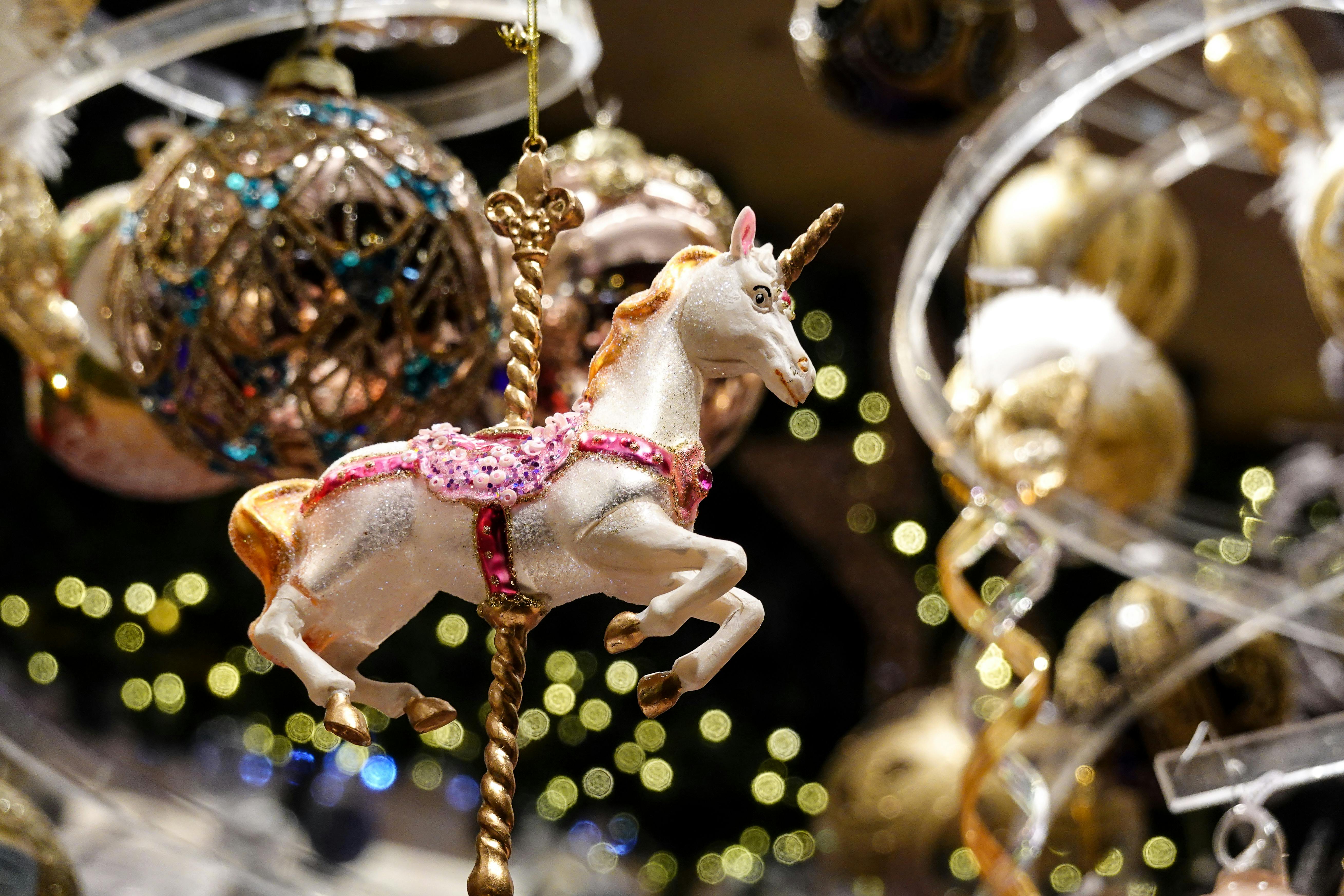 festive unicorn ornament amidst christmas decor