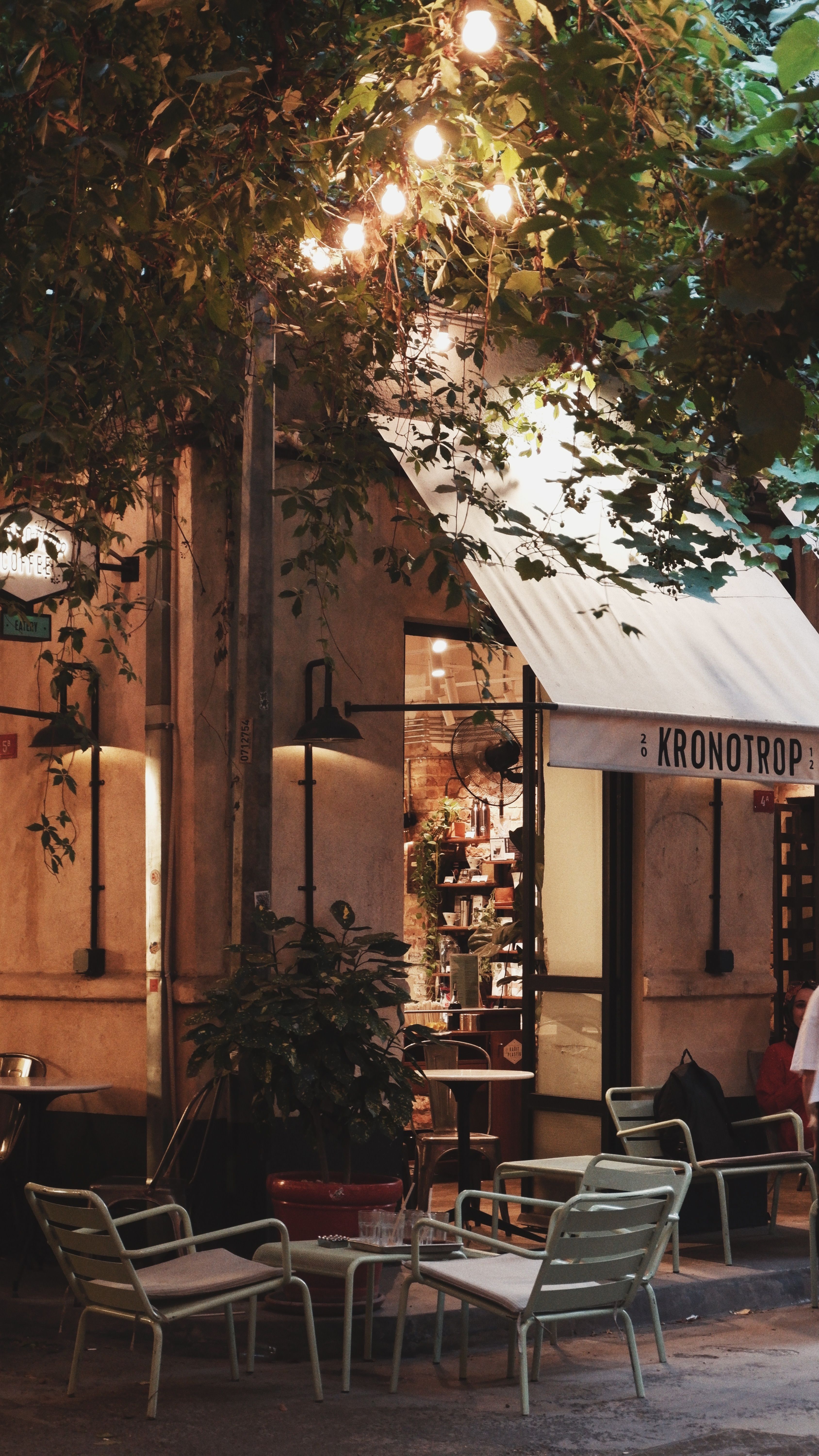 Atmospheric outdoor cafe with warm lighting