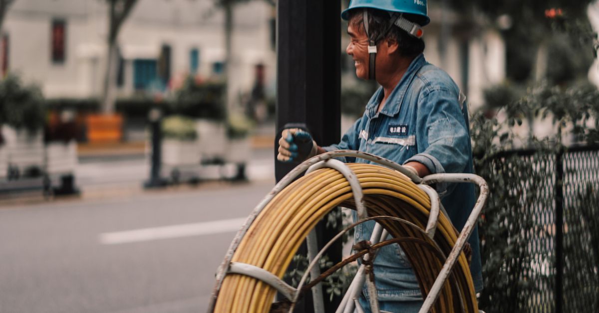 Street Laborers Street Worker with Cable Equipment in Urban Area · Free Stock Photo