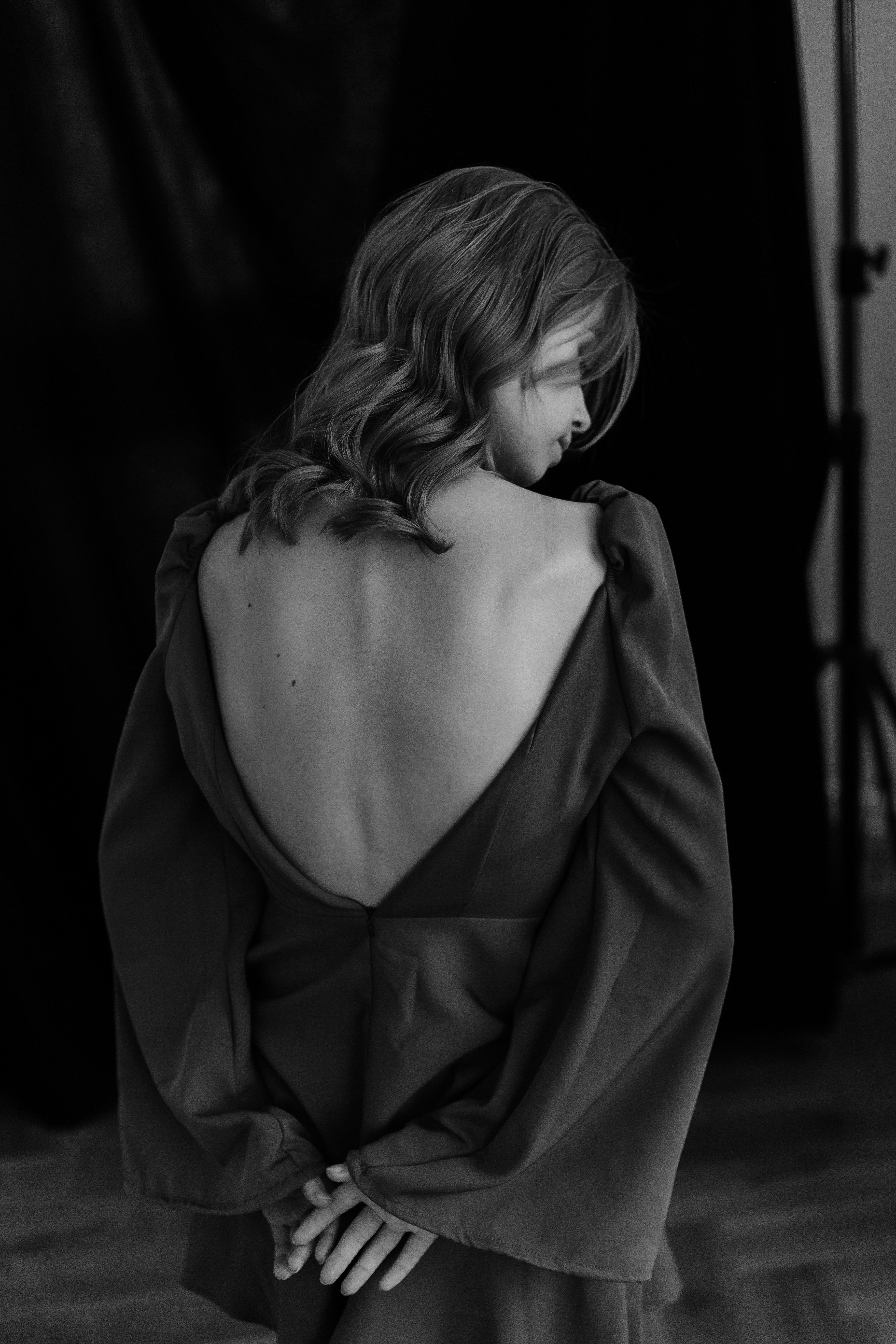 Elegant Woman Posing in Stylish Backless Dress  Free Stock Photo
