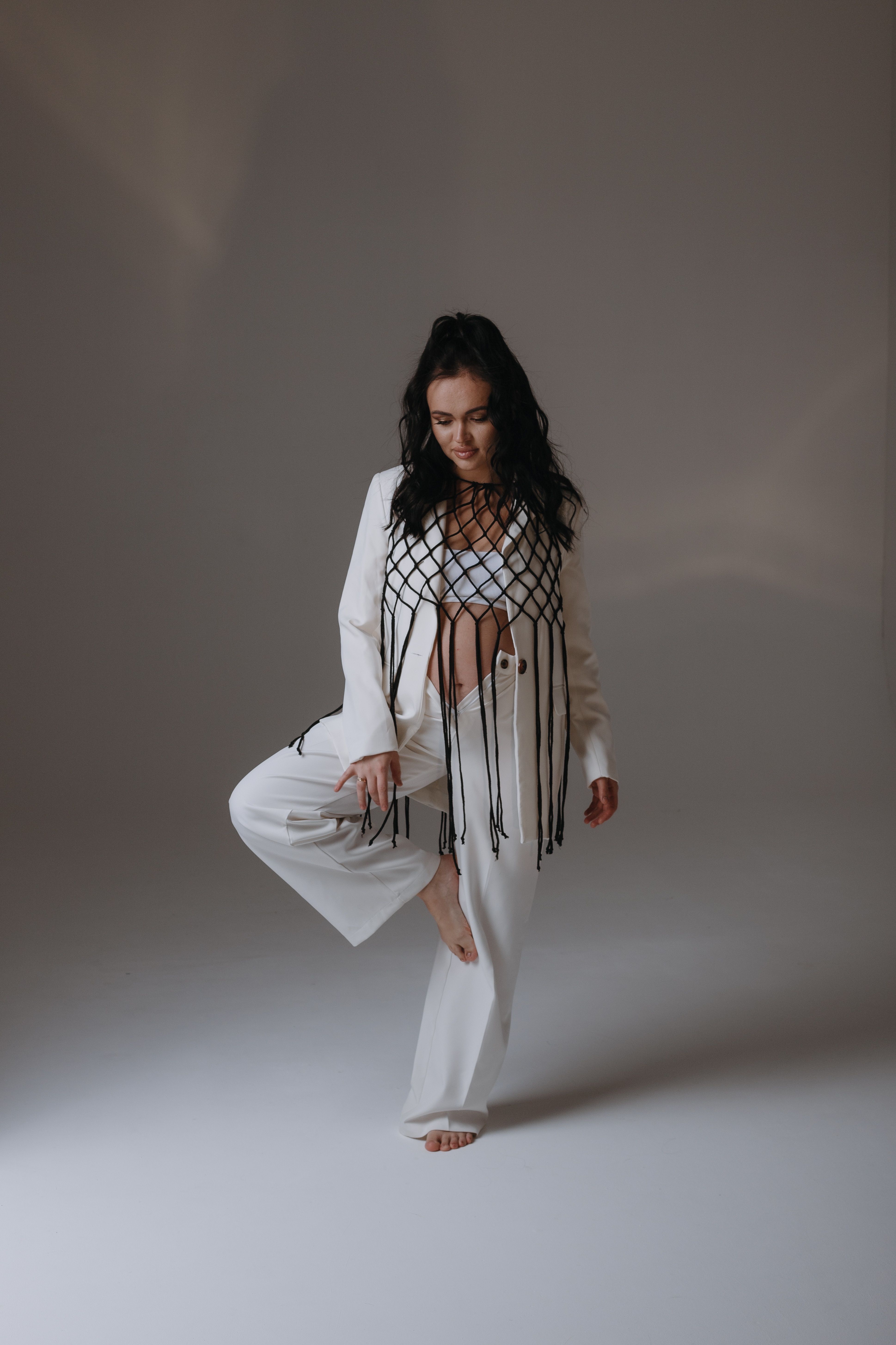 Elegant Woman Posing in Stylish White Outfit · Free Stock Photo