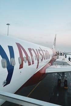 A FlyArystan plane parked on the tarmac at Almaty International Airport.