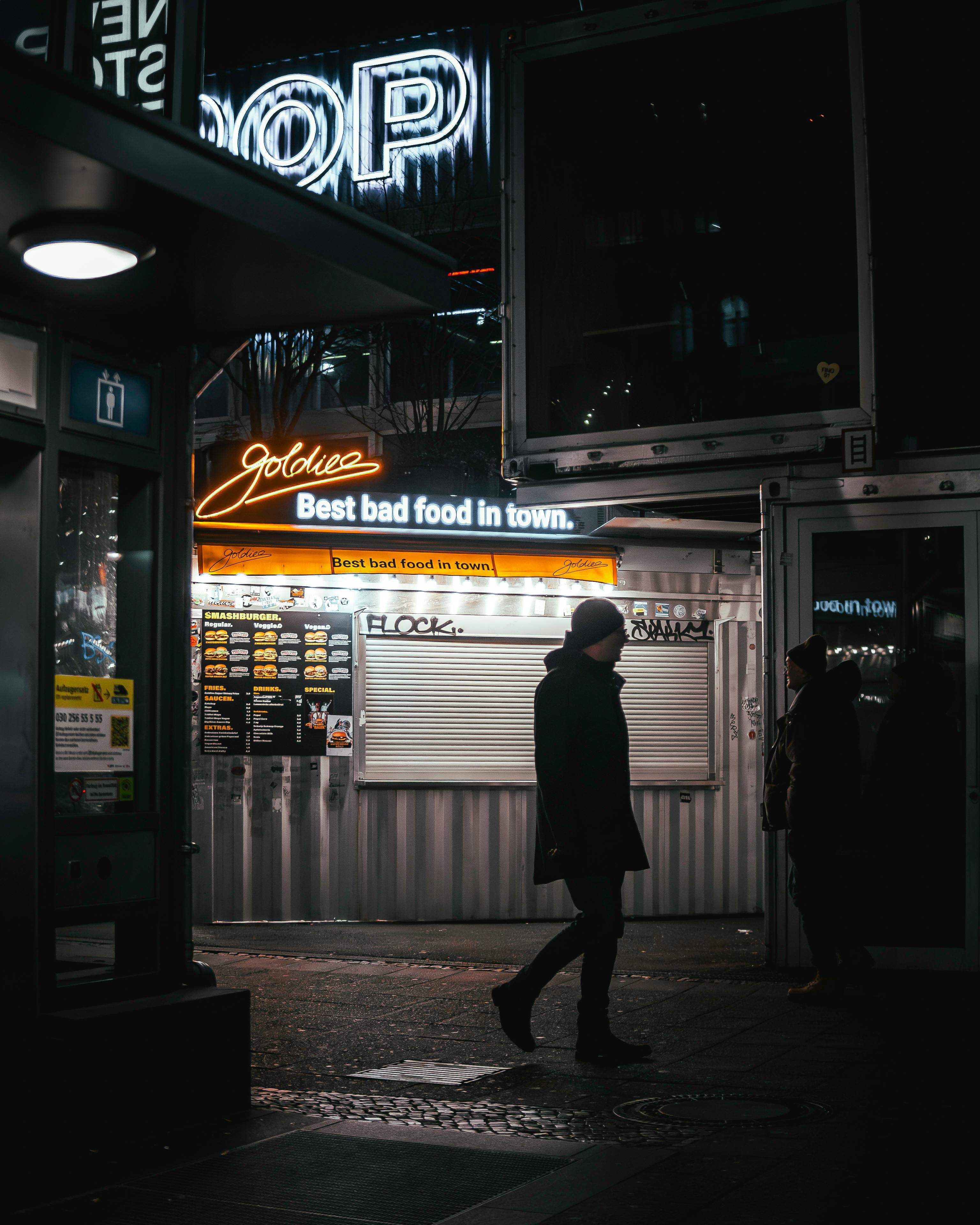 nightlife in berlin street scene with neon lights