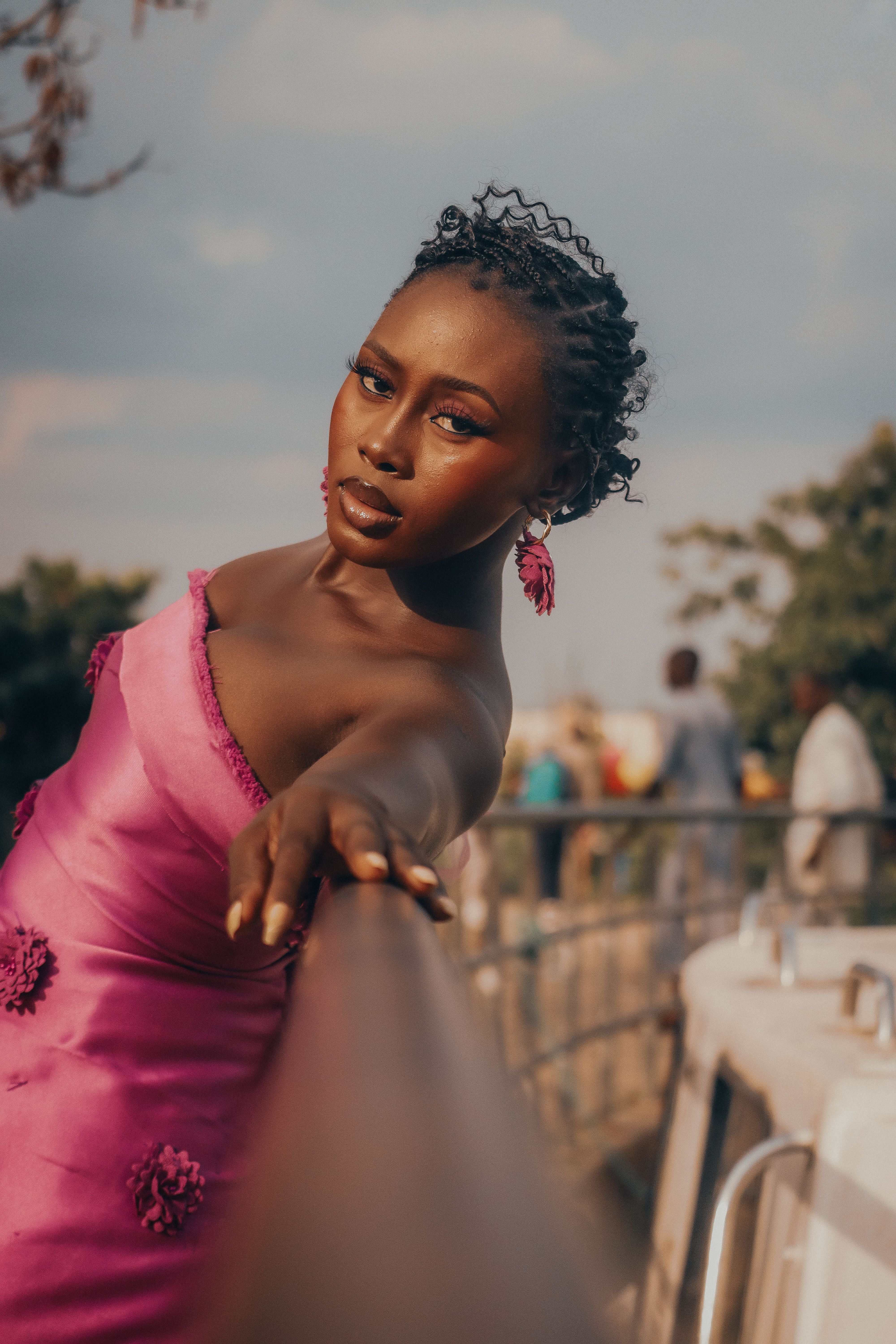 Elegant Woman Posing in Pink Dress Outdoors · Free Stock Photo