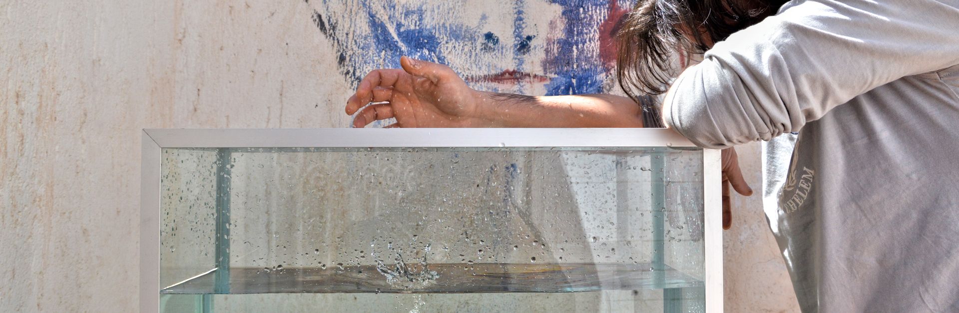 A creative depiction of a tomato splash in water with artistic graffiti background and contemplative