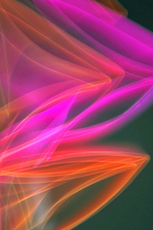 Free Vibrant abstract image capturing colorful light trails with a modern artistic flair. Stock Photo