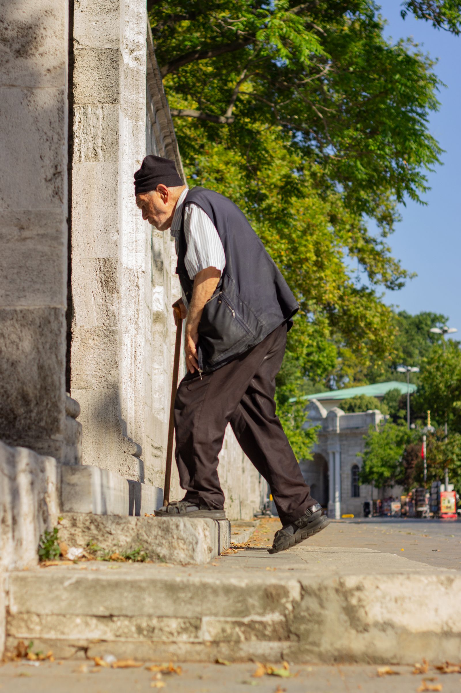 Senior man walking with a cane