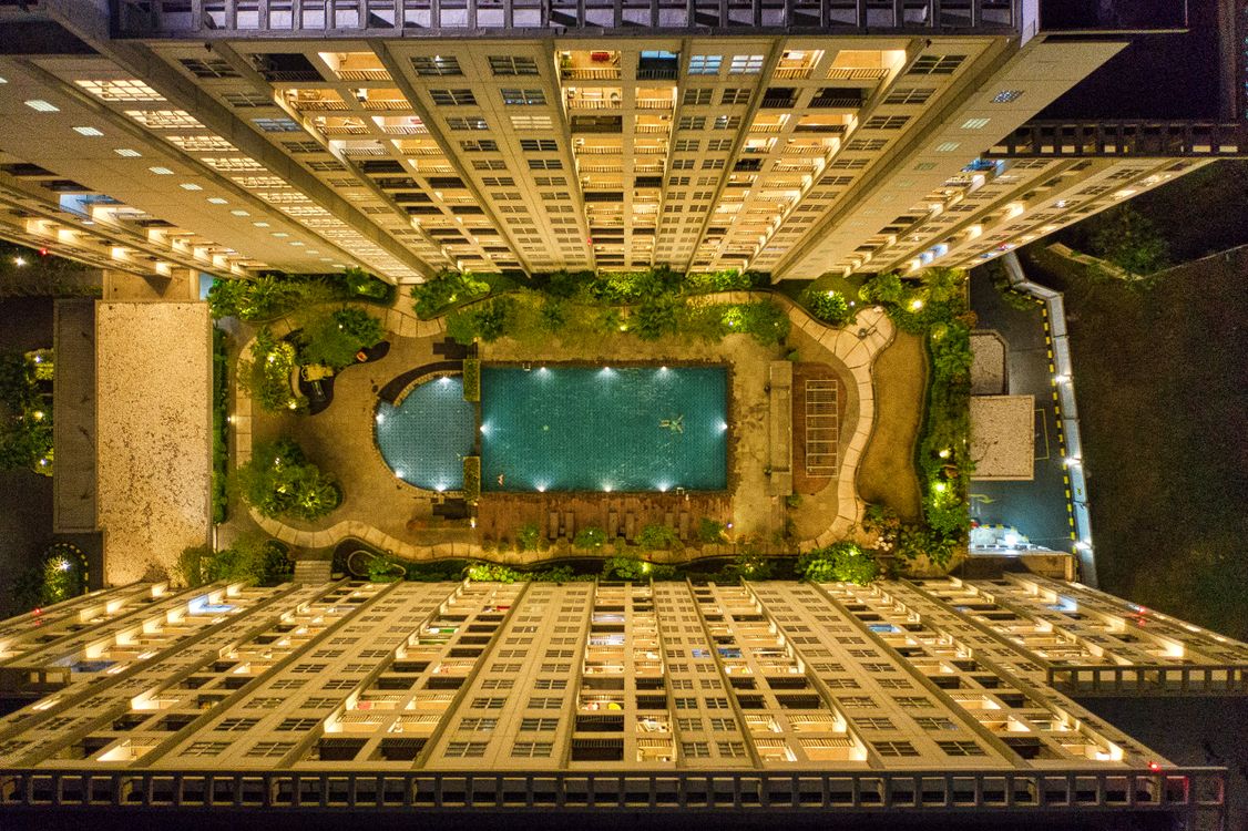 High-angle Photography of Rectangular Green Swimming Pool in Between ...