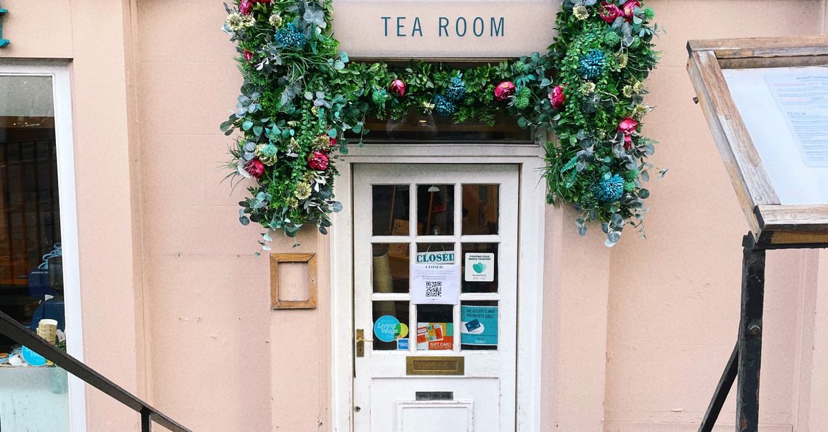 Charming Tea Room Entrance with Floral Decor · Free Stock Photo