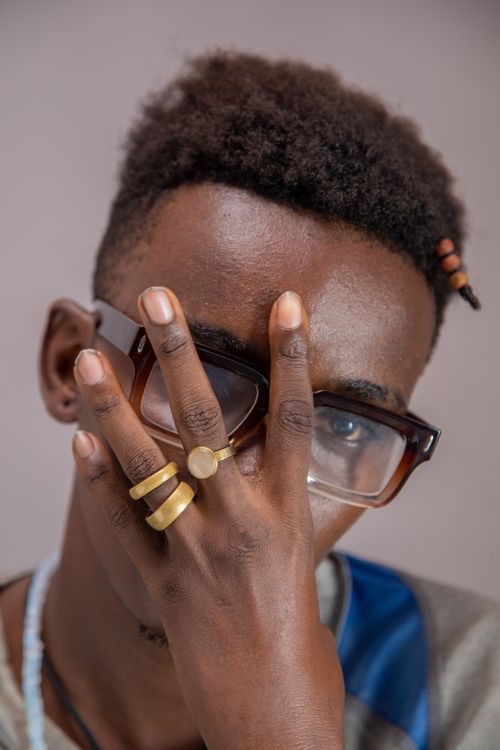 Free Close-up portrait showcasing elegant accessories and unique glasses style. Stock Photo