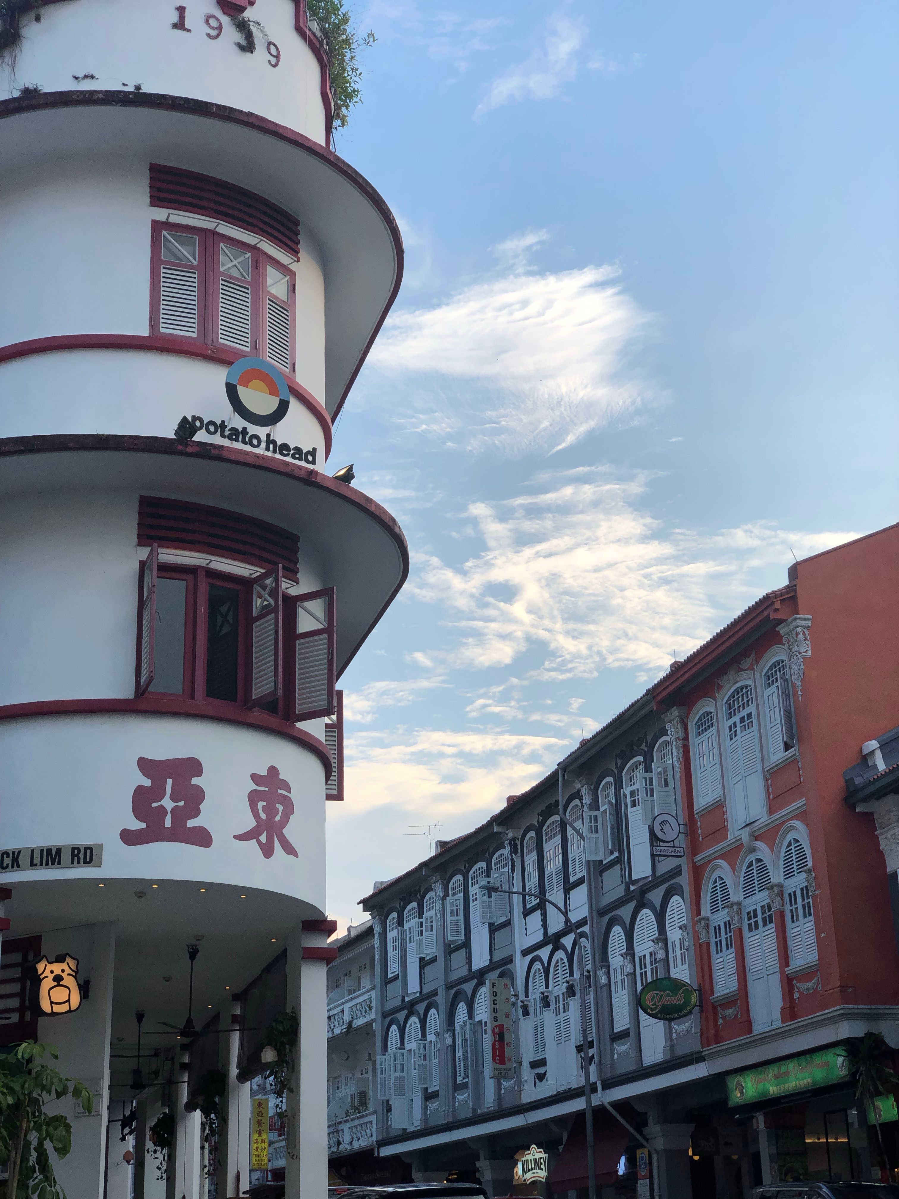 Photo of Chinatown's Potato Head building with displaying unique architecture against a clear sky.
