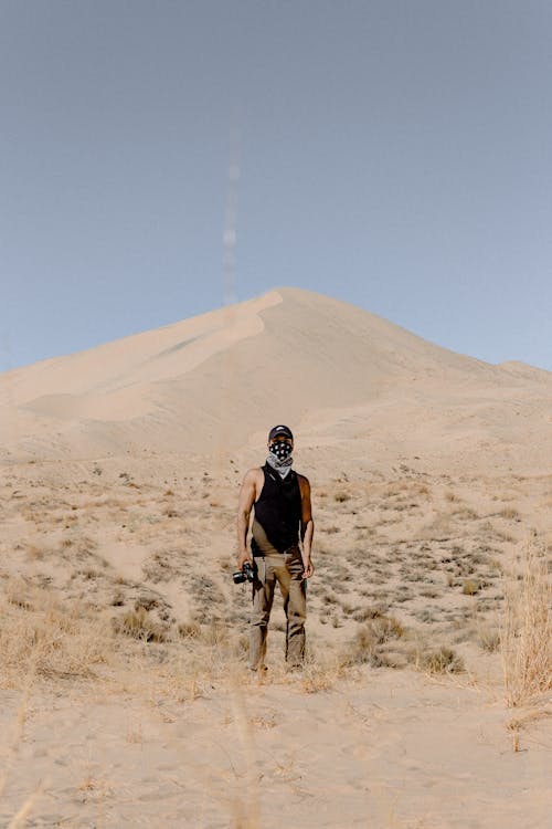 Man Standing on Desert