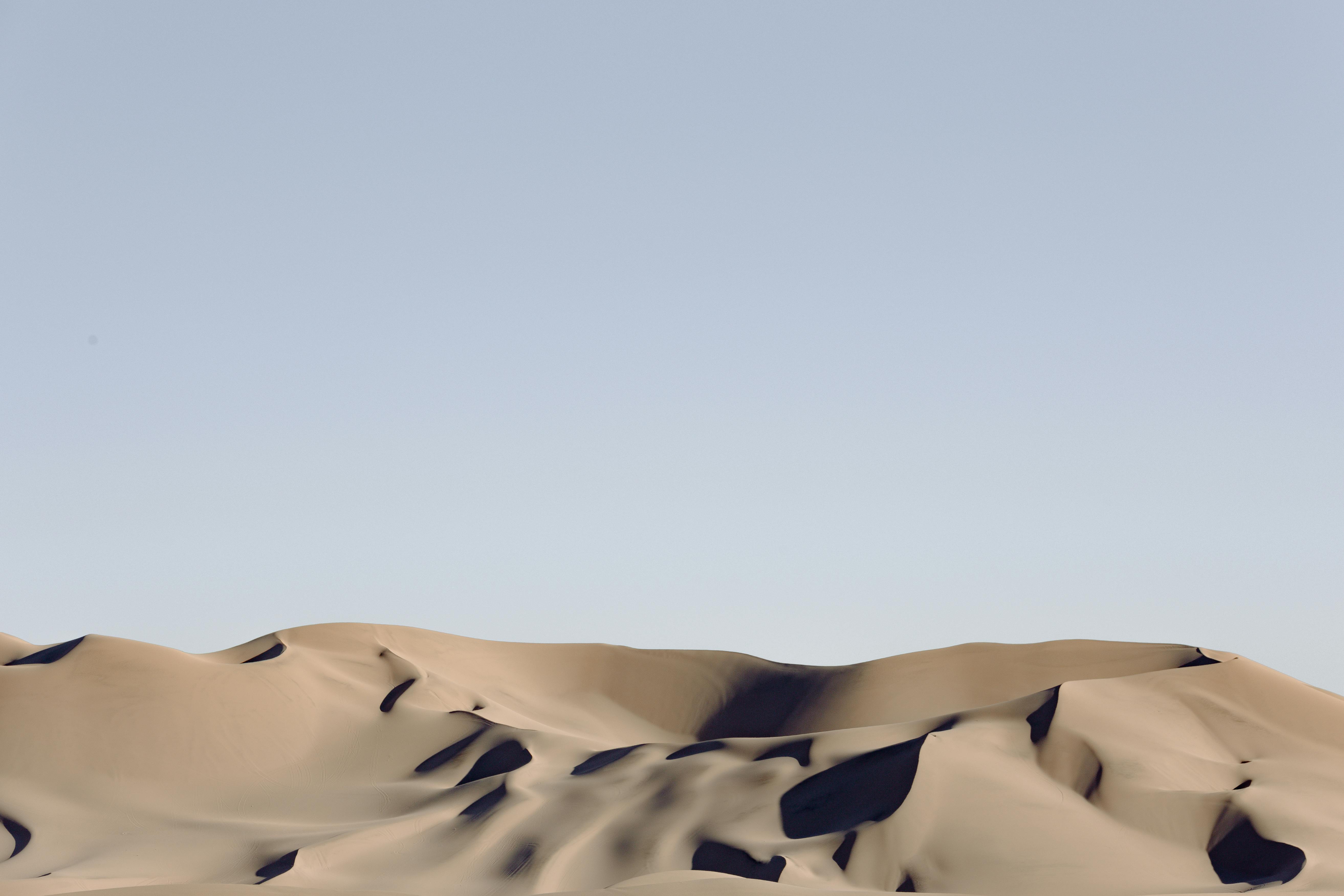 gray desert under blue sky