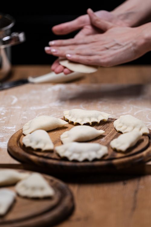 Dumpling Hand Hands Crafting Dumplings on Wooden Surface · Free Stock Photo