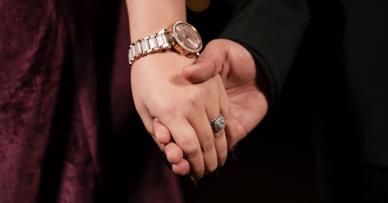 Close up Of Couple Holding Hands In Warm Lighting Free Stock Photo close-up-of-couple-holding-hands-in-warm-lighting-free-stock-photo