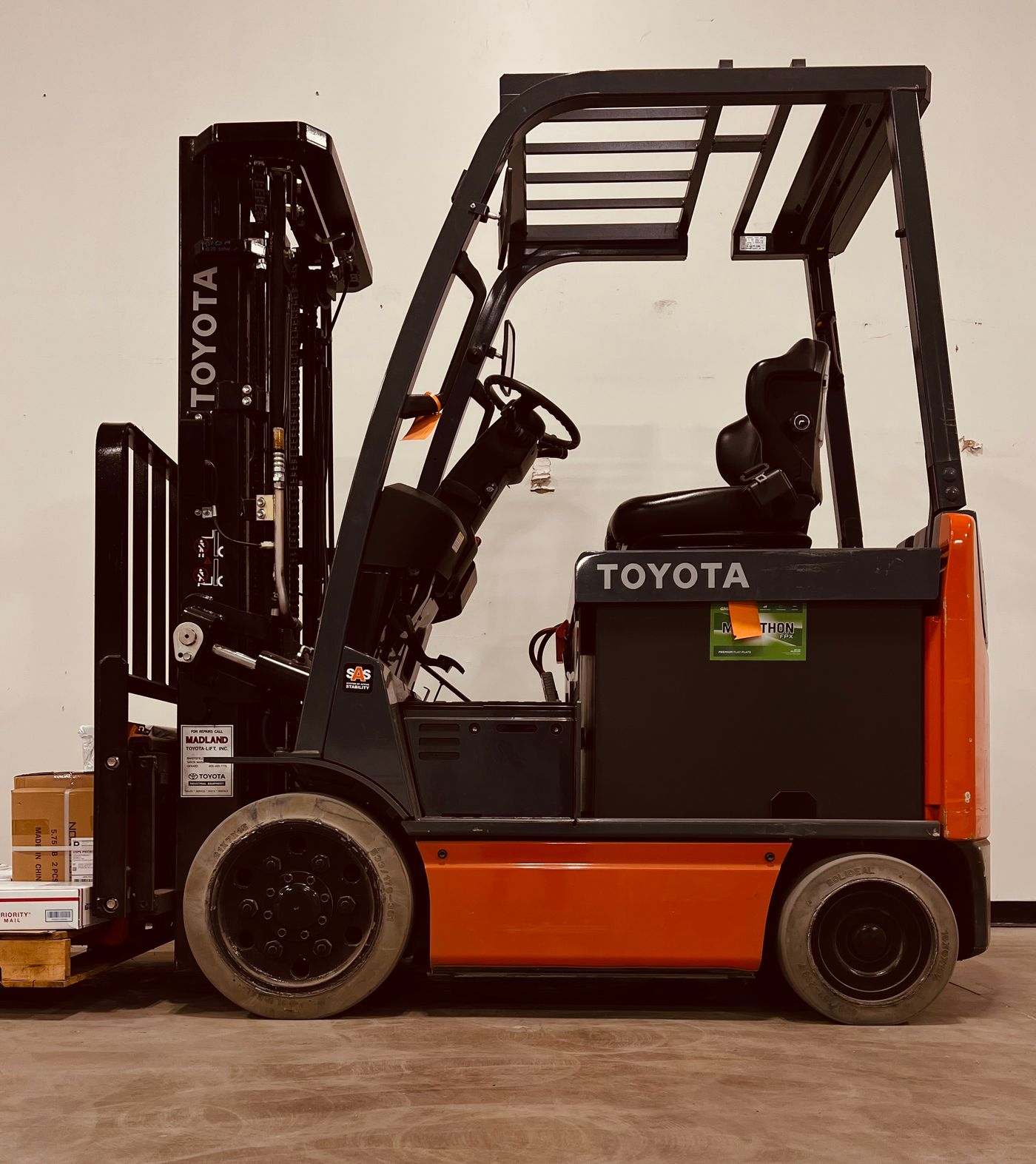 Electric forklift in warehouse
