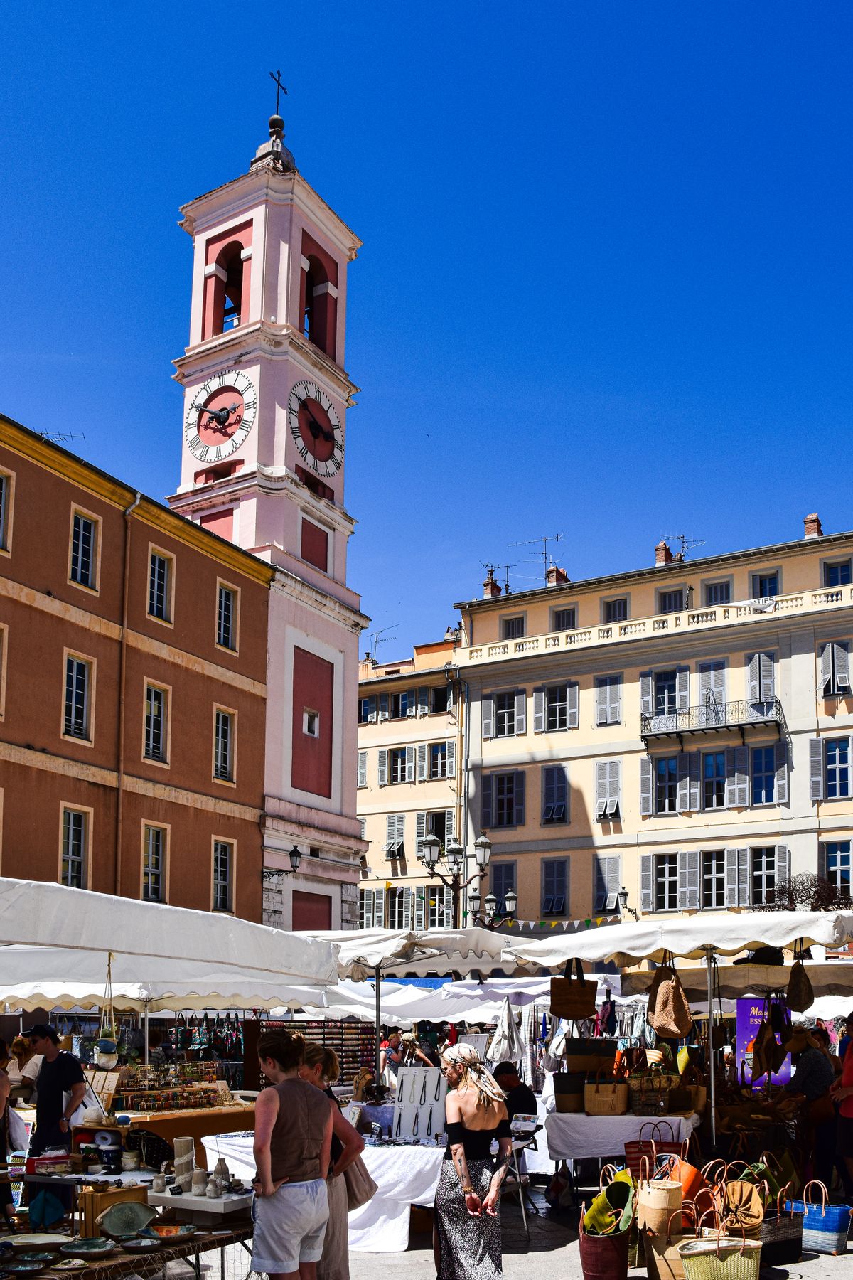 The Cours Saleya market and pink clock tower in Vieux Nice