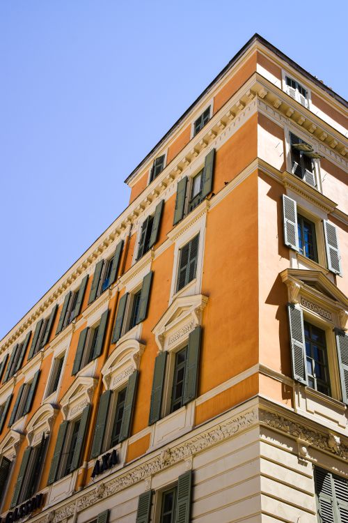 Free Corner view of a classic building with shutters in Provence-Alpes-Côte d'Azur, France. Stock Photo